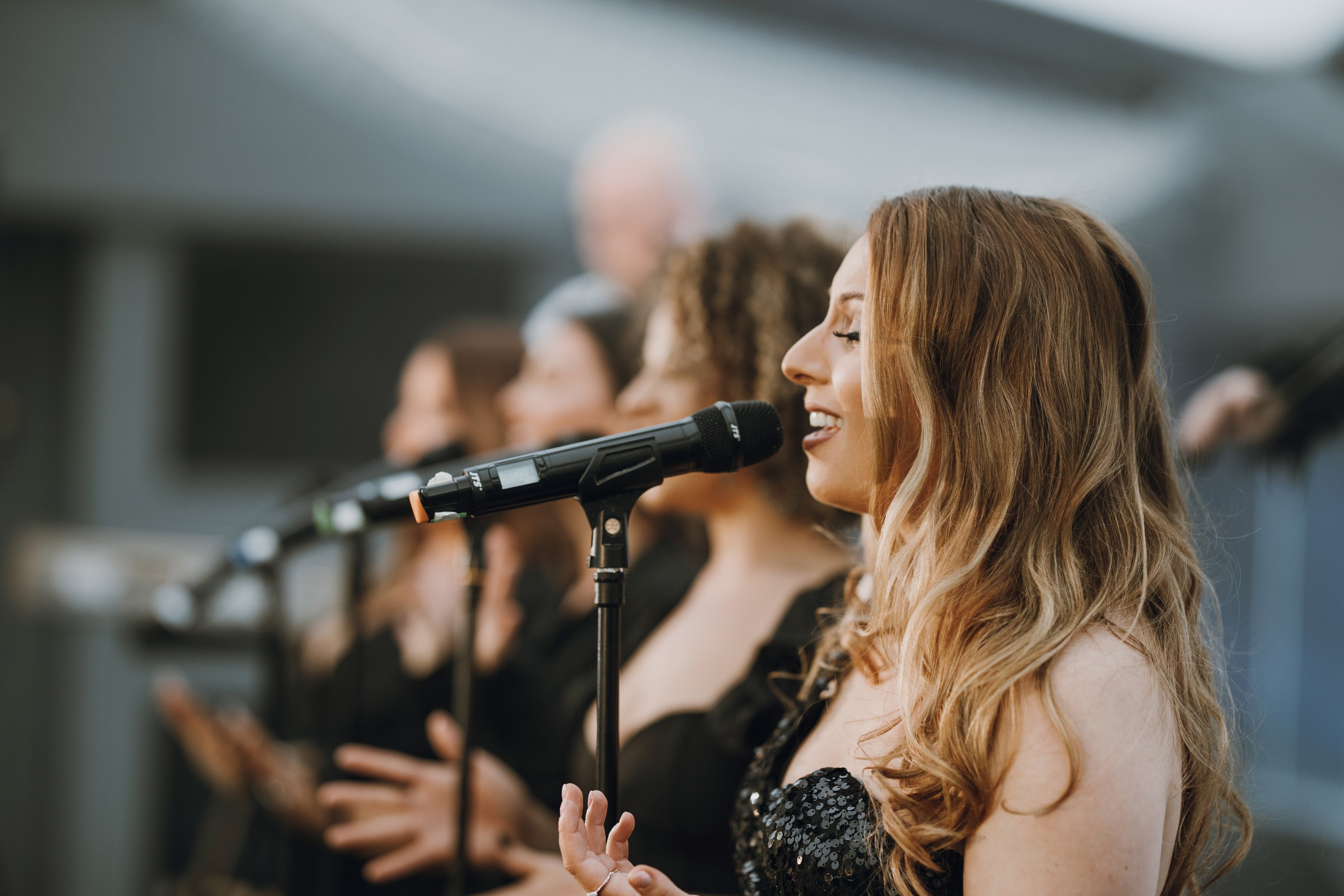 A singer performing for a crowd of people