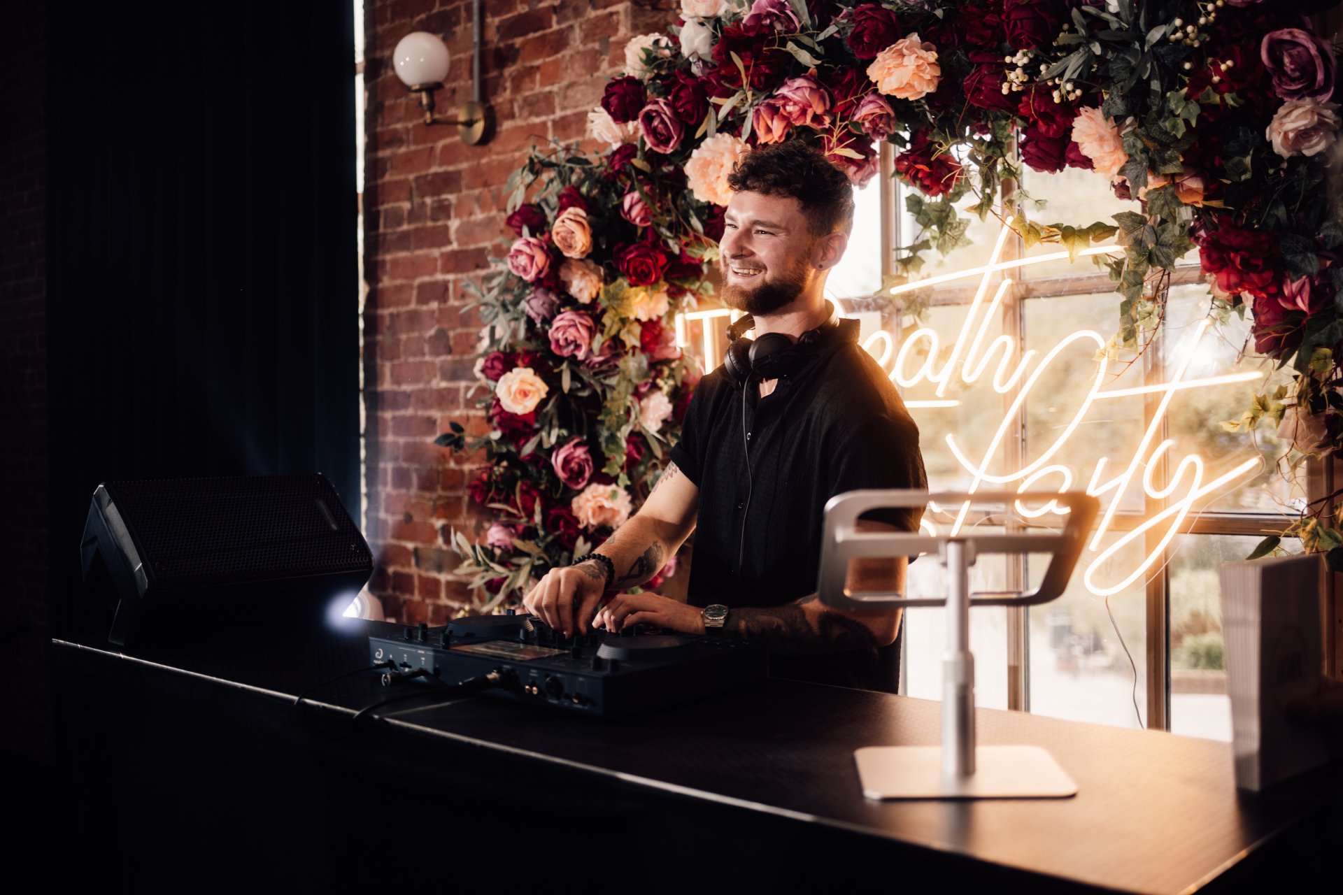 A DJ in a suit performing