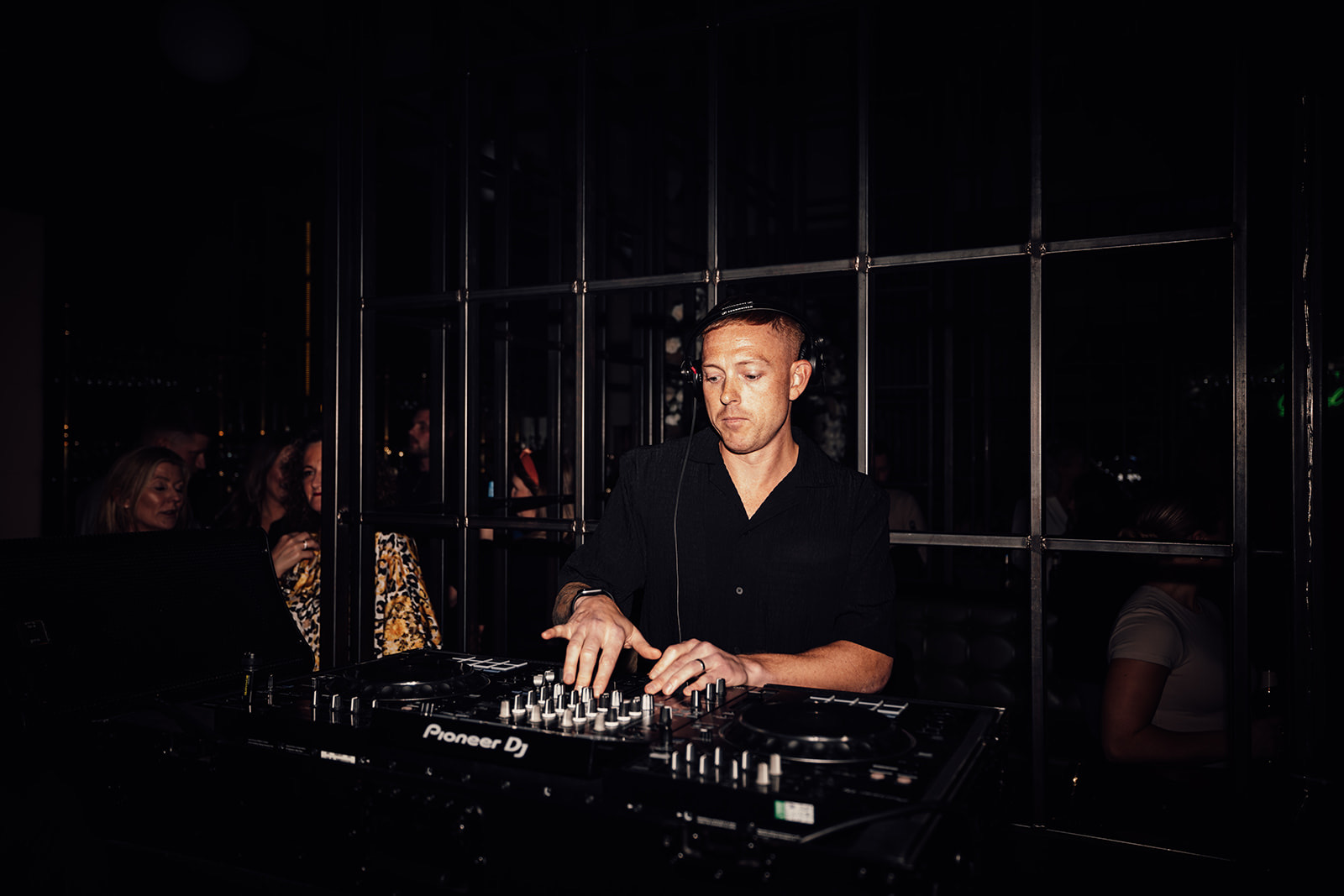 DJ in a bath holding his decks