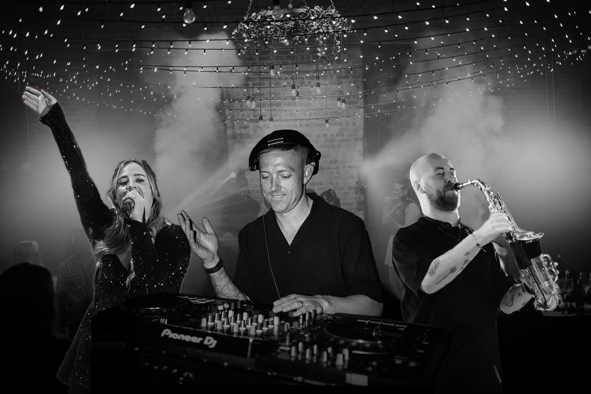 A DJ performing in a garden at a wedding